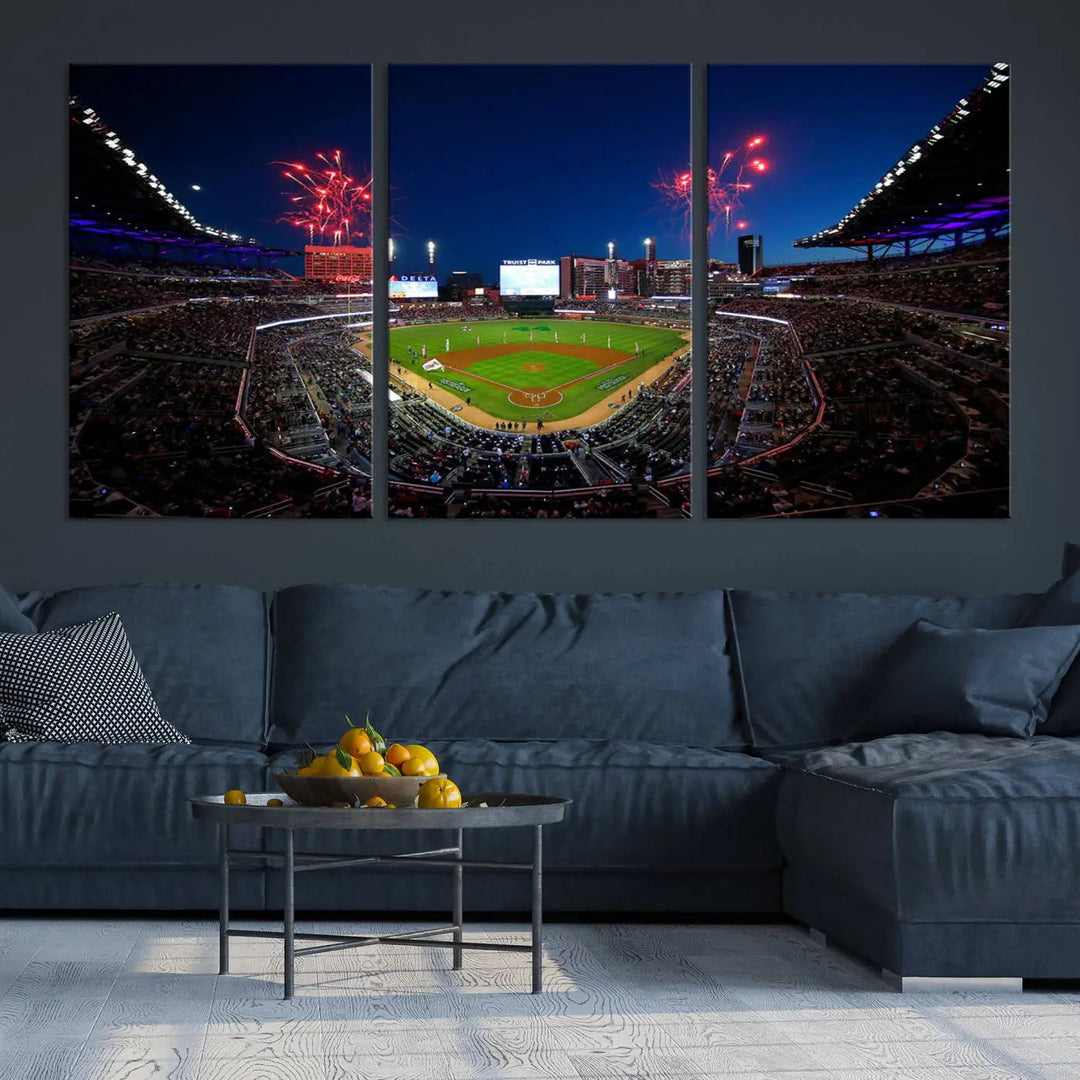 A nighttime scene of Truist Park with fireworks lighting up the sky comes to life in the Truist Park Atlanta Braves Baseball Stadium Wall Art Print, a large 3-panel canvas perfect for sports fans.