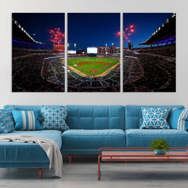 A nighttime scene of Truist Park with fireworks lighting up the sky comes to life in the Truist Park Atlanta Braves Baseball Stadium Wall Art Print, a large 3-panel canvas perfect for sports fans.