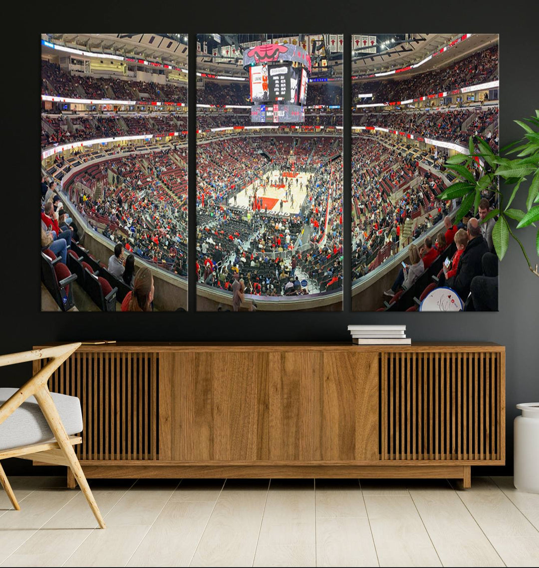 A panoramic view captures the bustling United Center during a Chicago Bulls game, showcasing the action on court and a prominent scoreboard overhead, ideal for immortalizing as a museum-quality canvas print.