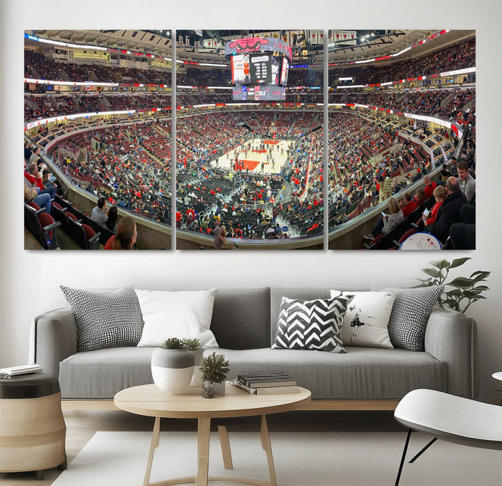 A panoramic view captures the bustling United Center during a Chicago Bulls game, showcasing the action on court and a prominent scoreboard overhead, ideal for immortalizing as a museum-quality canvas print.