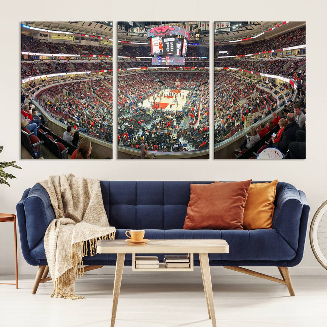 A panoramic view captures the bustling United Center during a Chicago Bulls game, showcasing the action on court and a prominent scoreboard overhead, ideal for immortalizing as a museum-quality canvas print.