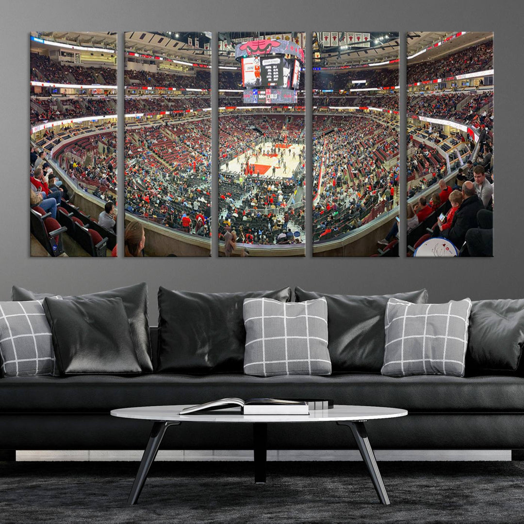 A panoramic view captures the bustling United Center during a Chicago Bulls game, showcasing the action on court and a prominent scoreboard overhead, ideal for immortalizing as a museum-quality canvas print.