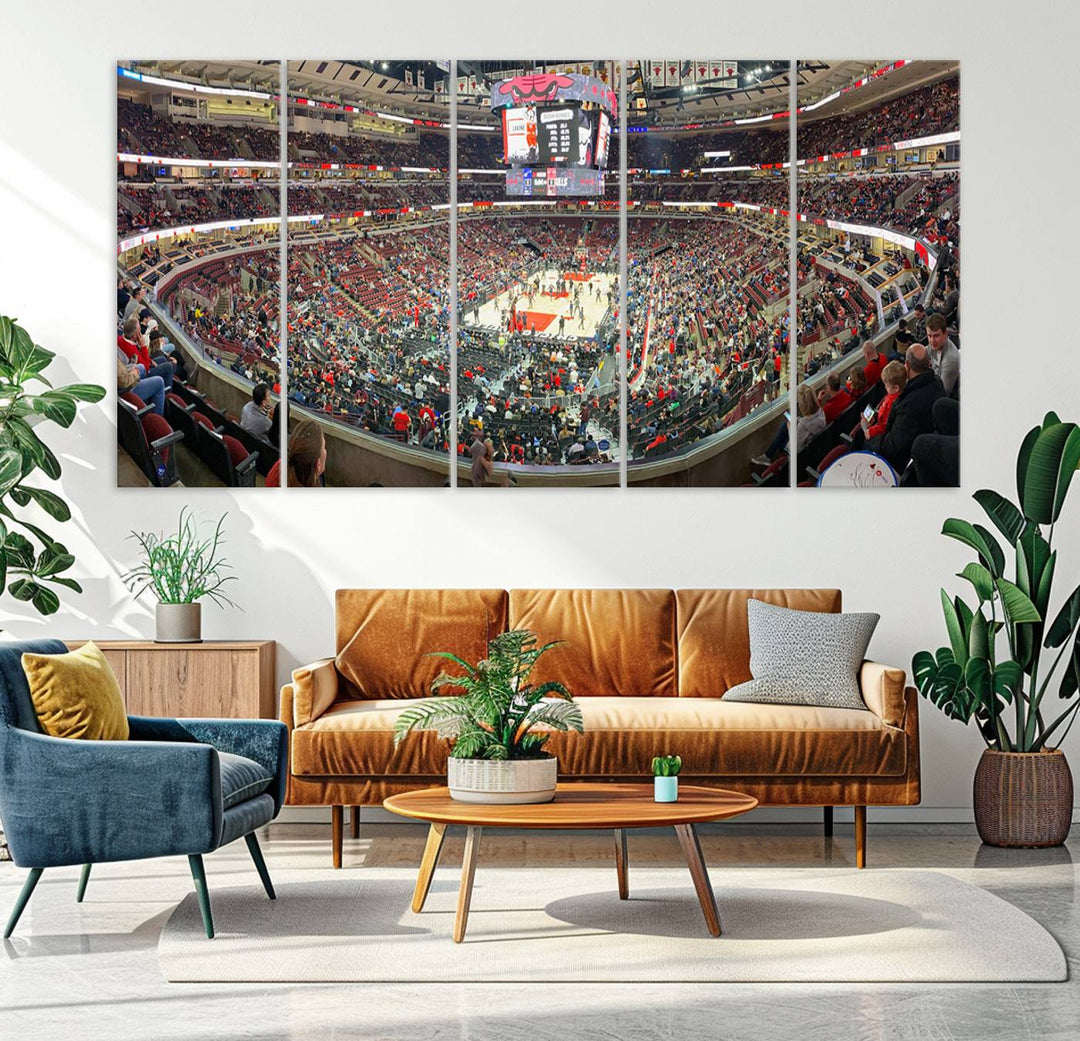 A panoramic view captures the bustling United Center during a Chicago Bulls game, showcasing the action on court and a prominent scoreboard overhead, ideal for immortalizing as a museum-quality canvas print.