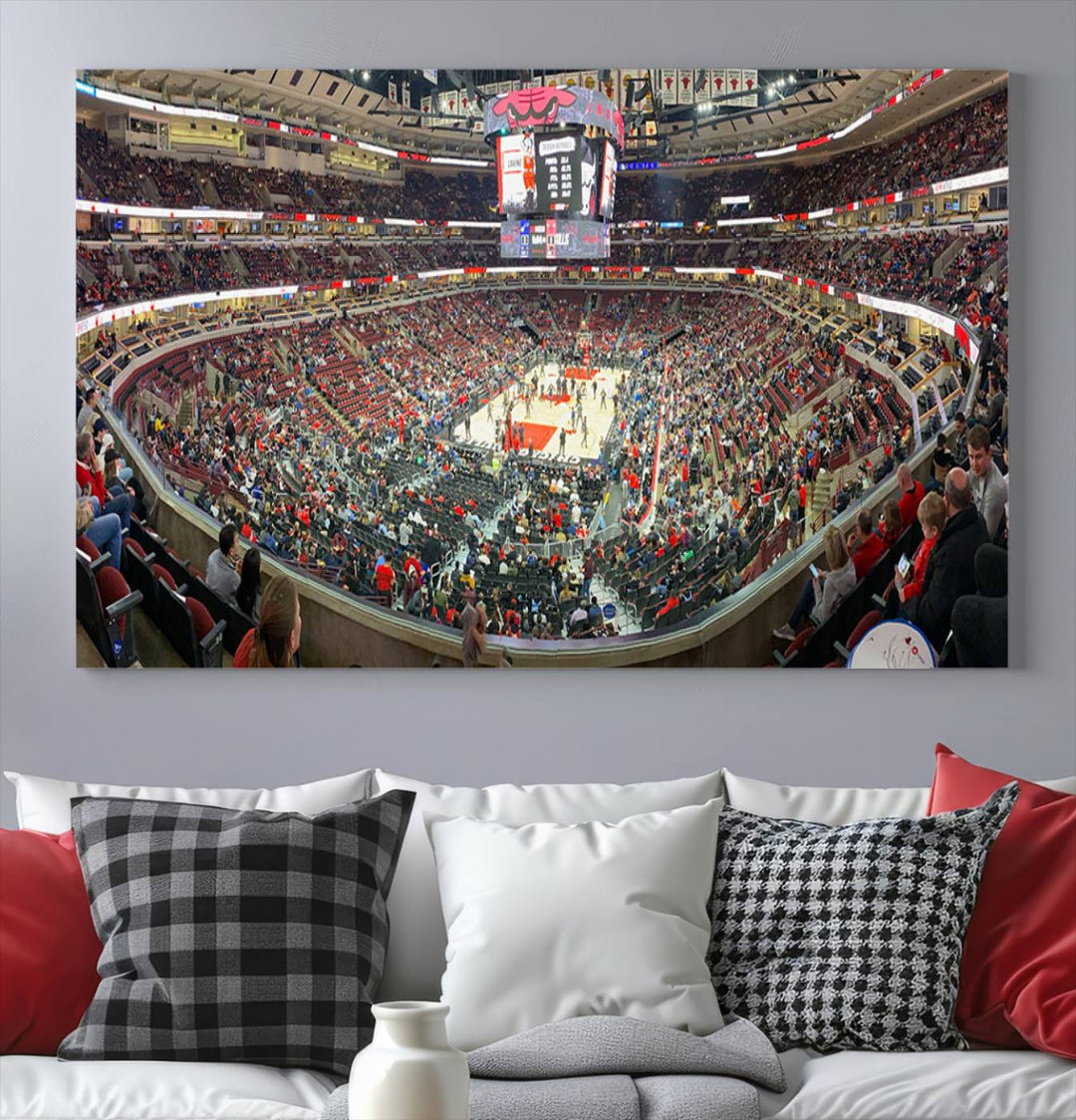 A panoramic view captures the bustling United Center during a Chicago Bulls game, showcasing the action on court and a prominent scoreboard overhead, ideal for immortalizing as a museum-quality canvas print.