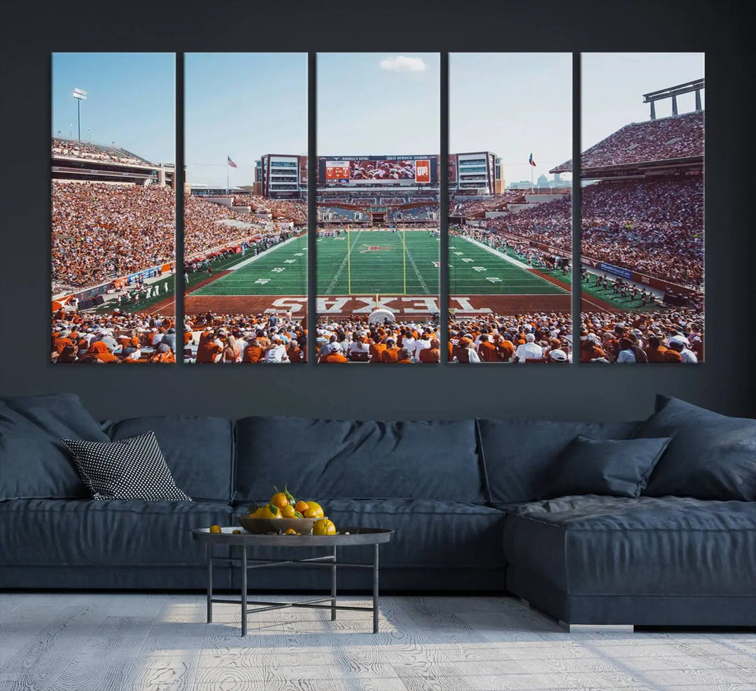 A University of Texas Longhorns Football Team Print, depicting the bustling Darrell K Royal-Texas Memorial Stadium at Campbell-Williams Field, is mounted in a modern living room.