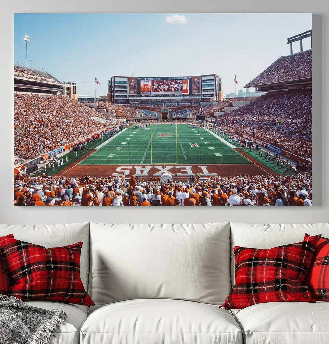 A University of Texas Longhorns Football Team Print, depicting the bustling Darrell K Royal-Texas Memorial Stadium at Campbell-Williams Field, is mounted in a modern living room.