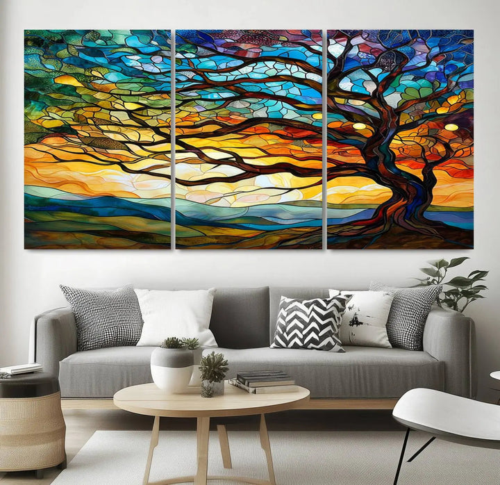 The Vibrant Mosaic Tree of Life Wall Art, with its stained glass style canvas print, is cleverly divided into three panels.