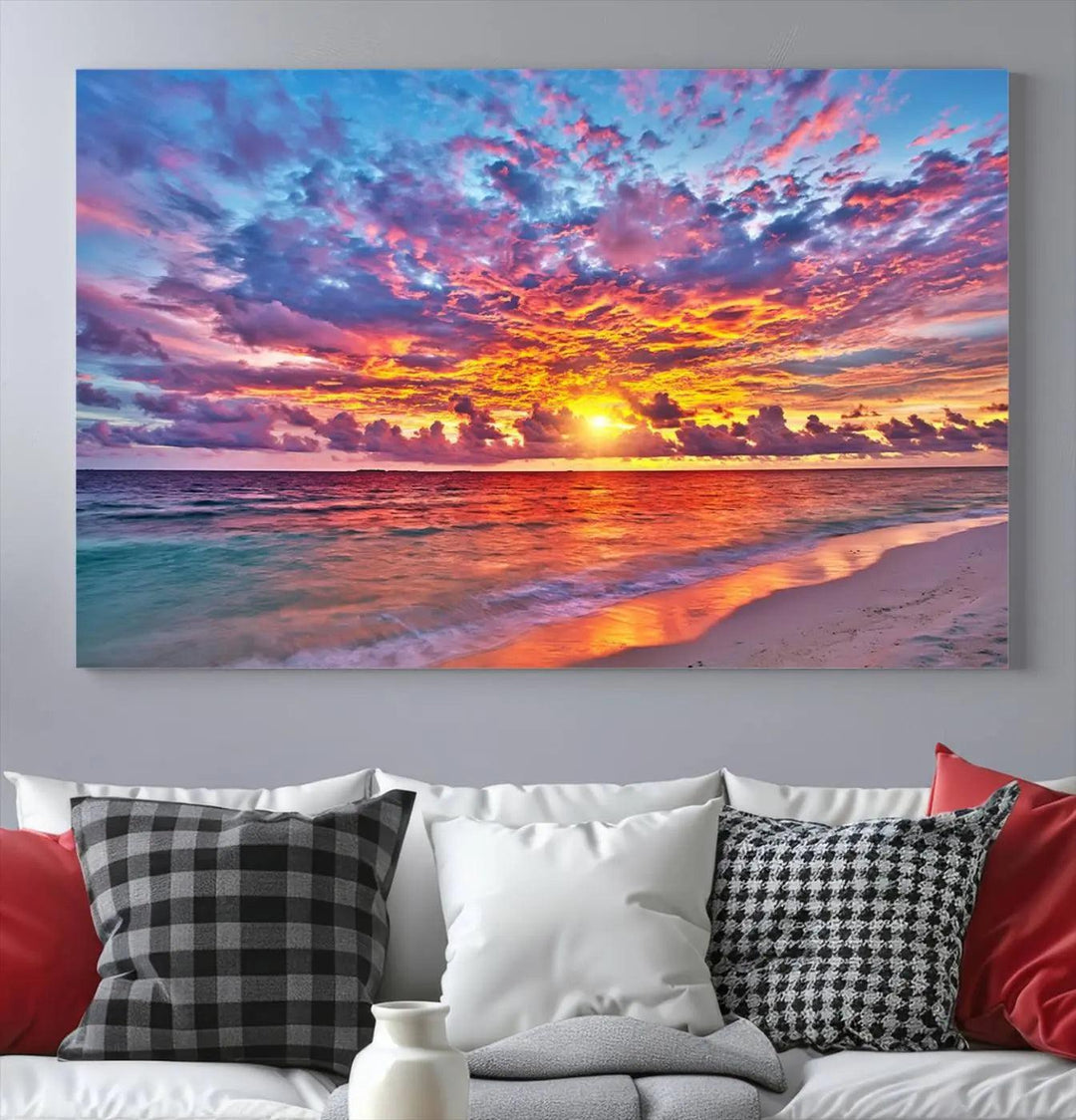 The living room showcases vibrant tropical sunset beach wall art canvas prints, highlighting a captivating coastal ocean waves scene.