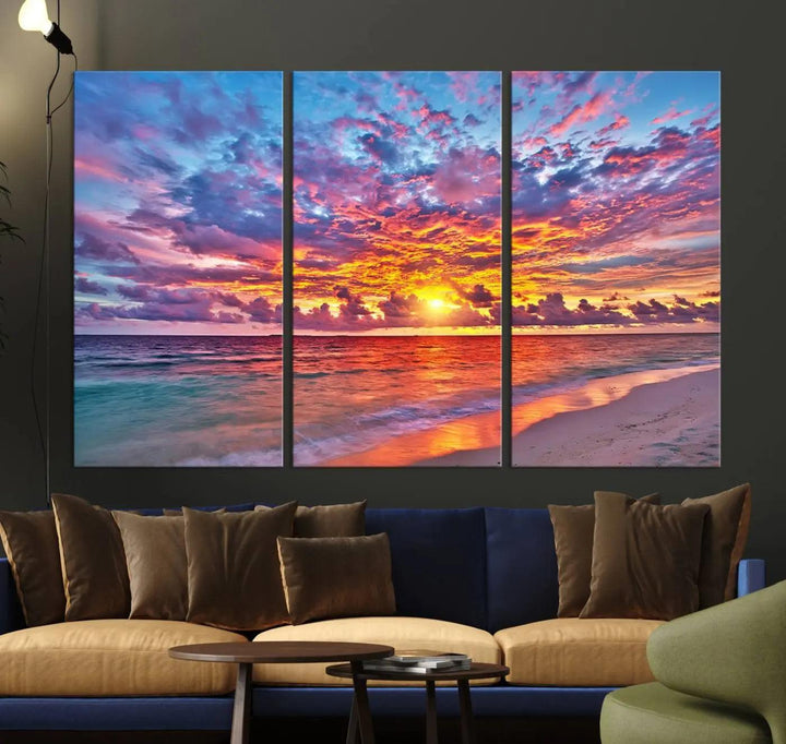 The living room showcases vibrant tropical sunset beach wall art canvas prints, highlighting a captivating coastal ocean waves scene.