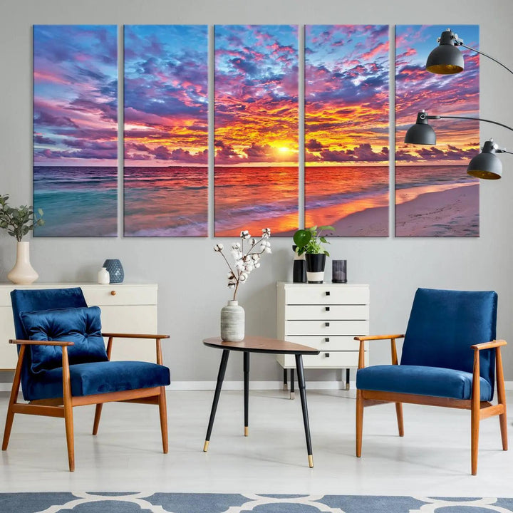 The living room showcases vibrant tropical sunset beach wall art canvas prints, highlighting a captivating coastal ocean waves scene.