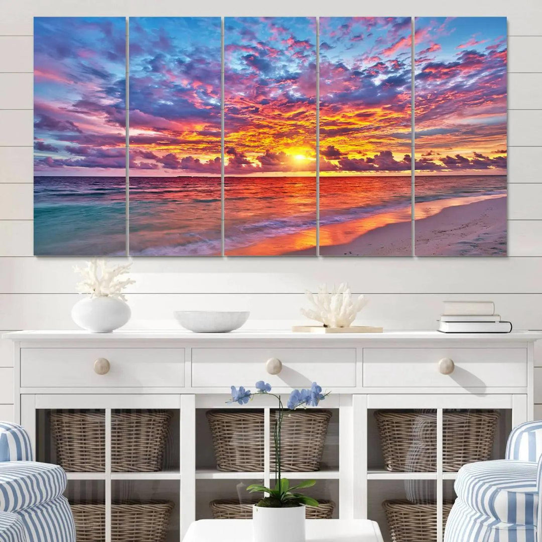 The living room showcases vibrant tropical sunset beach wall art canvas prints, highlighting a captivating coastal ocean waves scene.