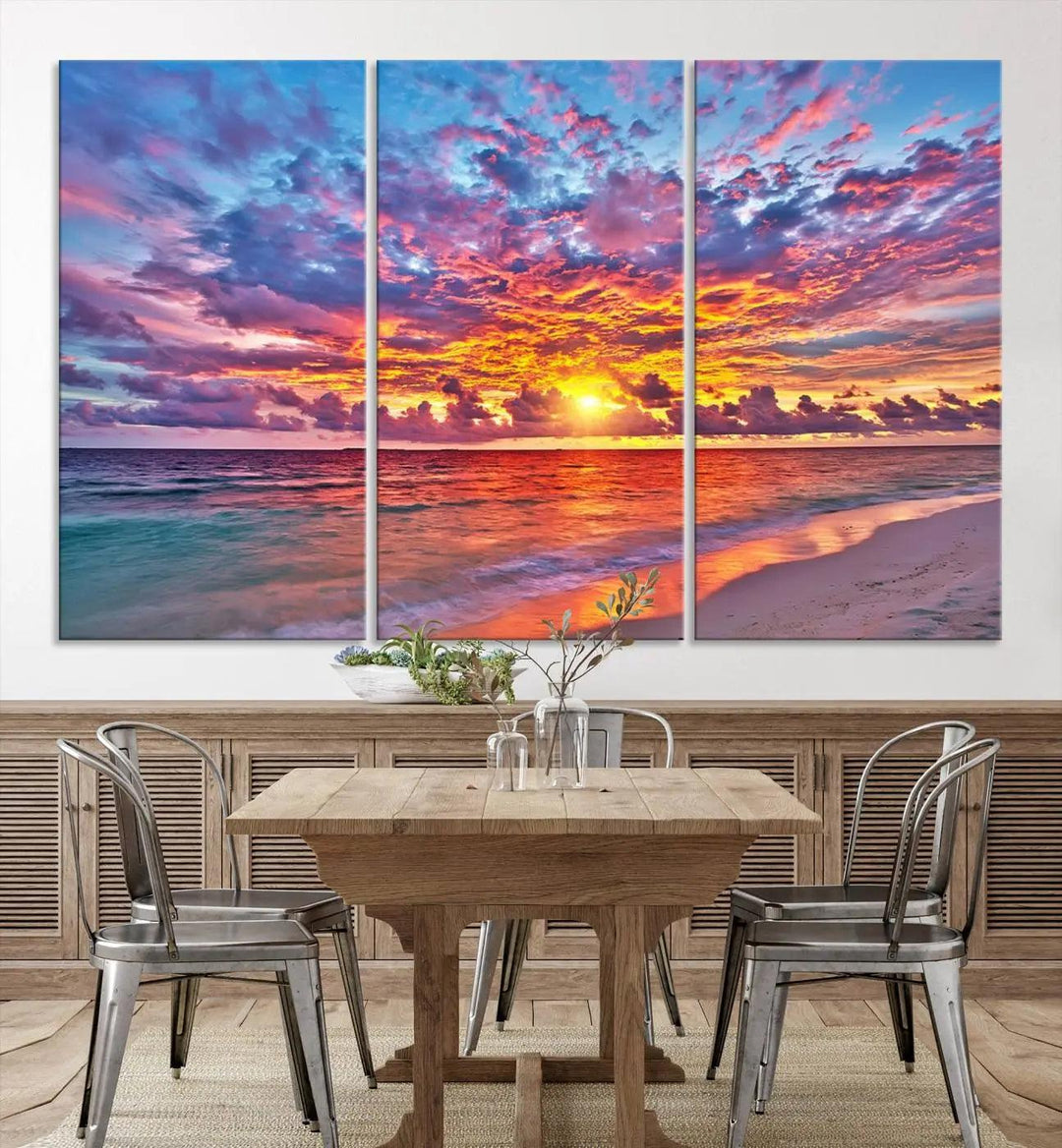 The living room showcases vibrant tropical sunset beach wall art canvas prints, highlighting a captivating coastal ocean waves scene.