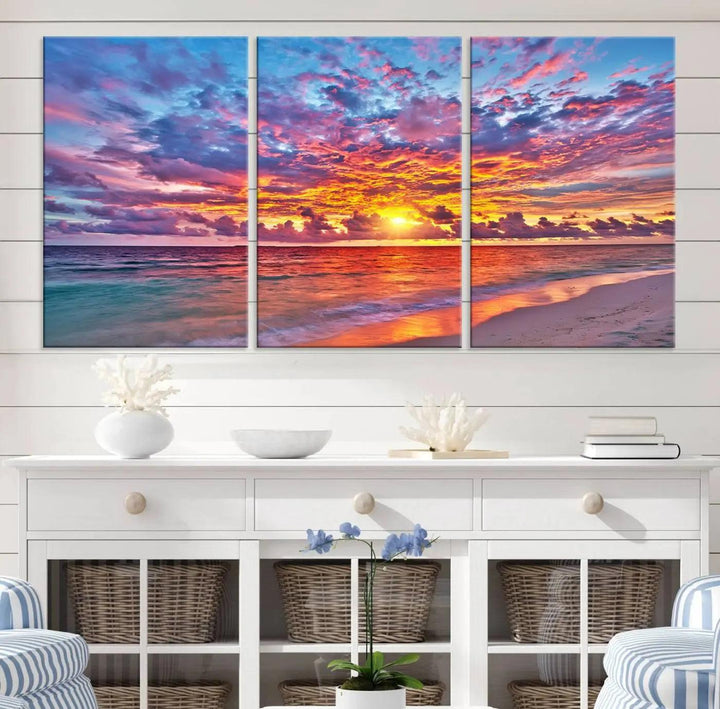 The living room showcases vibrant tropical sunset beach wall art canvas prints, highlighting a captivating coastal ocean waves scene.