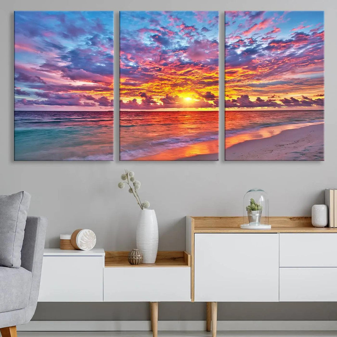 The living room showcases vibrant tropical sunset beach wall art canvas prints, highlighting a captivating coastal ocean waves scene.