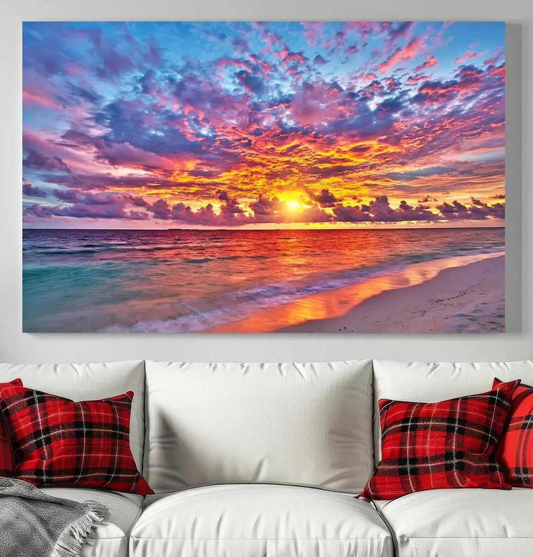 The living room showcases vibrant tropical sunset beach wall art canvas prints, highlighting a captivating coastal ocean waves scene.