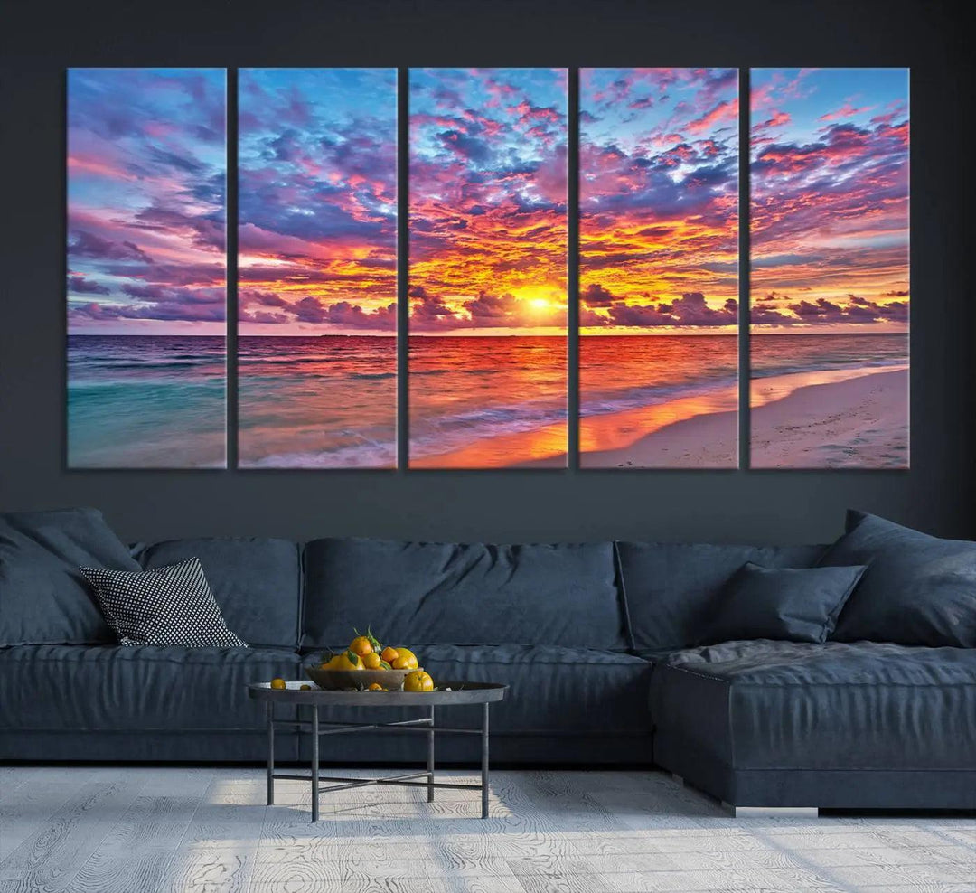 The living room showcases vibrant tropical sunset beach wall art canvas prints, highlighting a captivating coastal ocean waves scene.