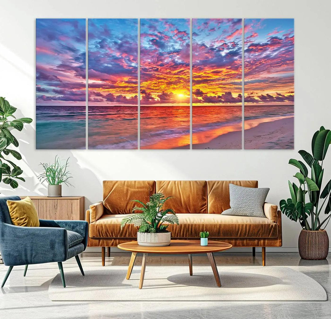 The living room showcases vibrant tropical sunset beach wall art canvas prints, highlighting a captivating coastal ocean waves scene.