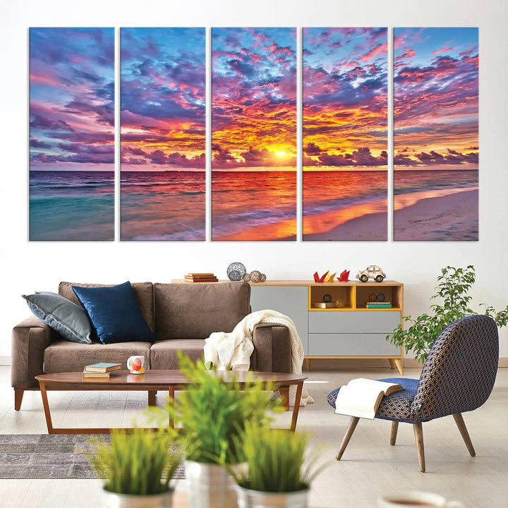 The living room showcases vibrant tropical sunset beach wall art canvas prints, highlighting a captivating coastal ocean waves scene.