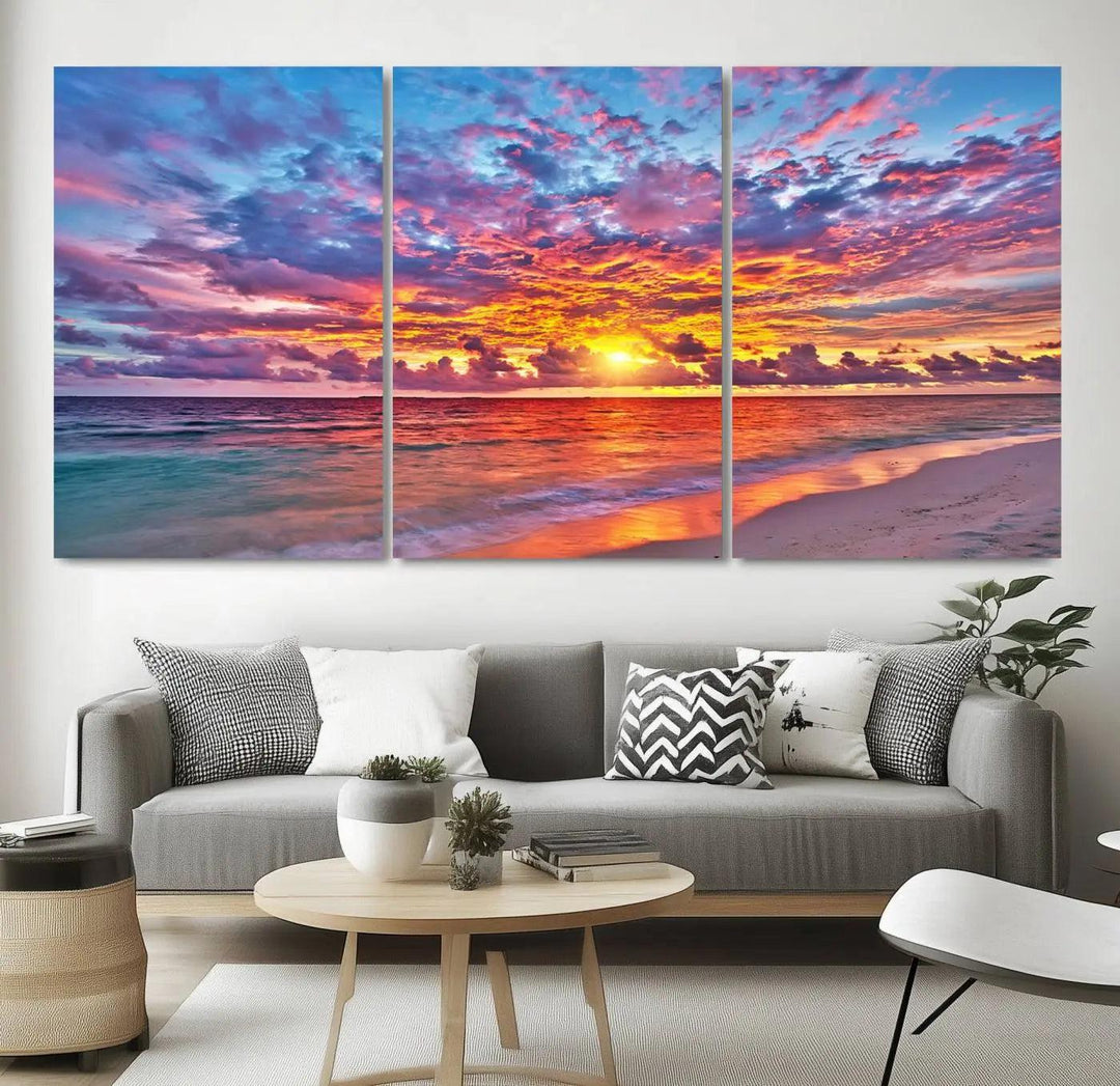 The living room showcases vibrant tropical sunset beach wall art canvas prints, highlighting a captivating coastal ocean waves scene.