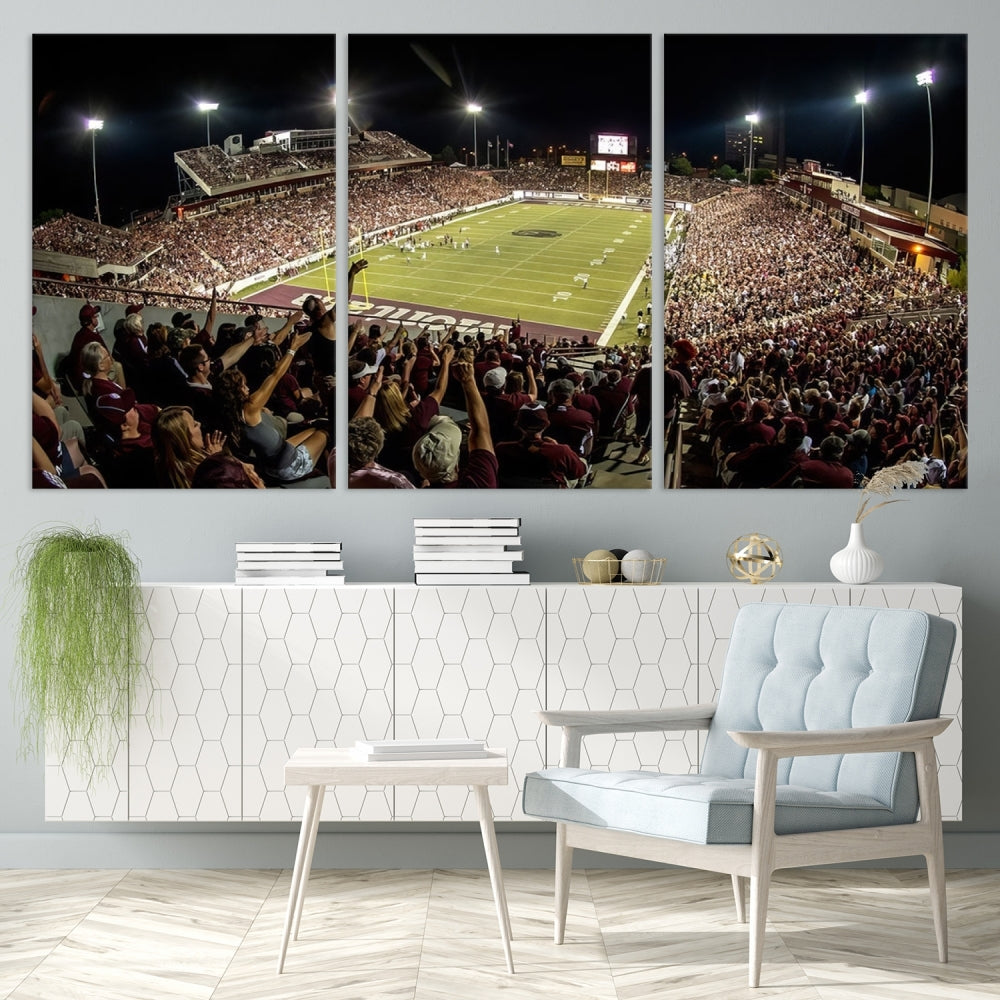 The Washington-Grizzly Stadium Canvas Print features a vibrant depiction of a packed football stadium at night. This American Football Wall Art is crafted on gallery-wrapped canvases with a UV-protective coating to maintain its lasting vibrancy.