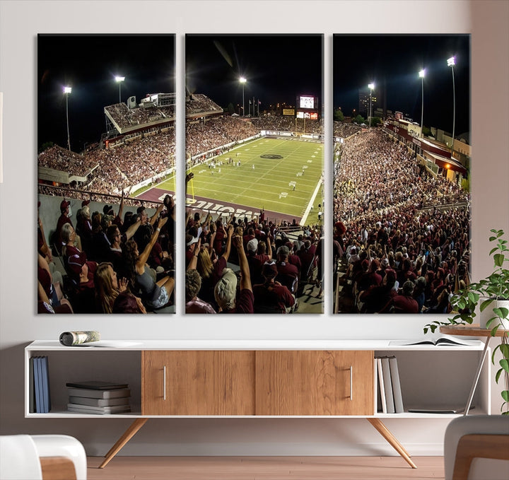 The Washington-Grizzly Stadium Canvas Print features a vibrant depiction of a packed football stadium at night. This American Football Wall Art is crafted on gallery-wrapped canvases with a UV-protective coating to maintain its lasting vibrancy.