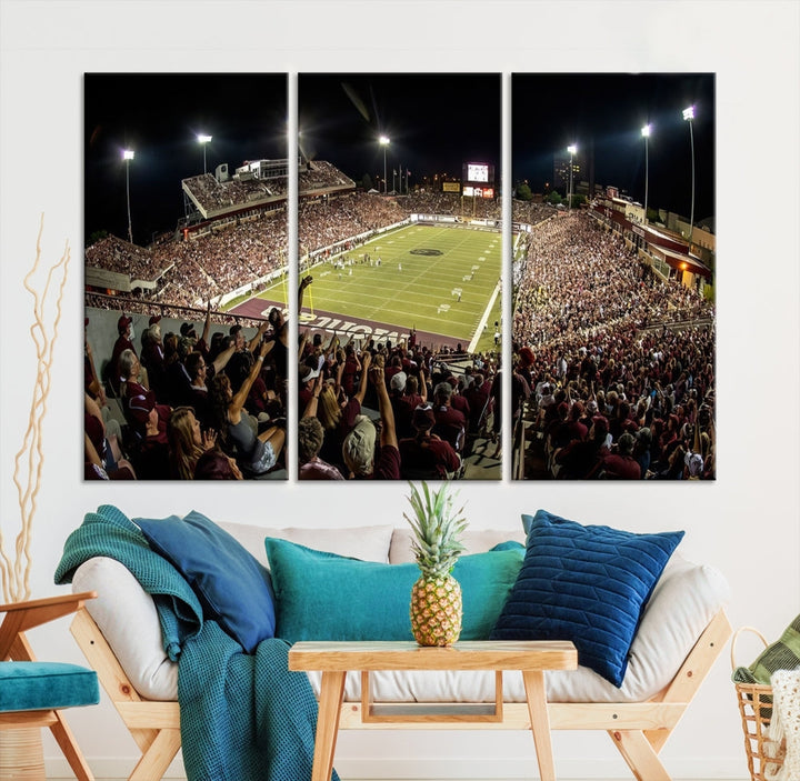 The Washington-Grizzly Stadium Canvas Print features a vibrant depiction of a packed football stadium at night. This American Football Wall Art is crafted on gallery-wrapped canvases with a UV-protective coating to maintain its lasting vibrancy.