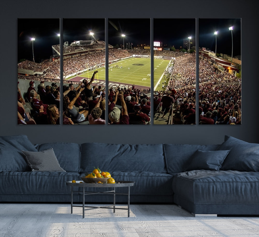 The Washington-Grizzly Stadium Canvas Print features a vibrant depiction of a packed football stadium at night. This American Football Wall Art is crafted on gallery-wrapped canvases with a UV-protective coating to maintain its lasting vibrancy.