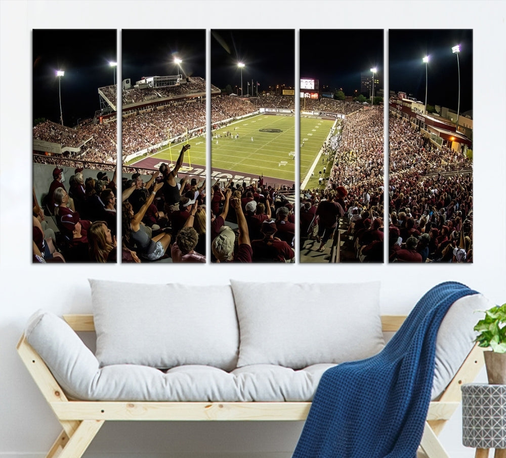 The Washington-Grizzly Stadium Canvas Print features a vibrant depiction of a packed football stadium at night. This American Football Wall Art is crafted on gallery-wrapped canvases with a UV-protective coating to maintain its lasting vibrancy.