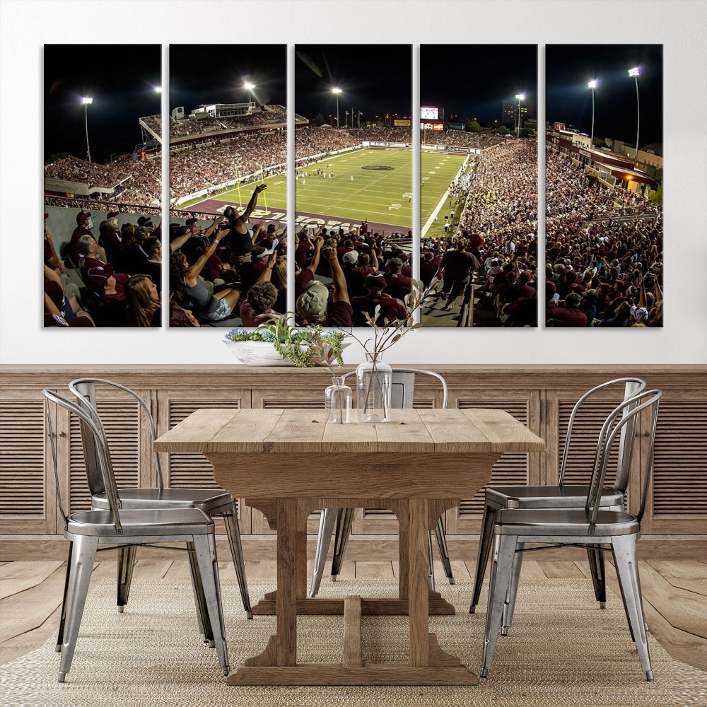 The Washington-Grizzly Stadium Canvas Print features a vibrant depiction of a packed football stadium at night. This American Football Wall Art is crafted on gallery-wrapped canvases with a UV-protective coating to maintain its lasting vibrancy.