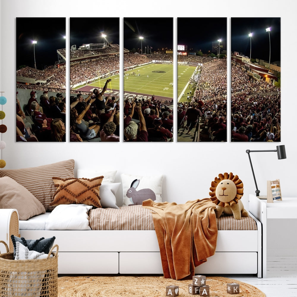 The Washington-Grizzly Stadium Canvas Print features a vibrant depiction of a packed football stadium at night. This American Football Wall Art is crafted on gallery-wrapped canvases with a UV-protective coating to maintain its lasting vibrancy.