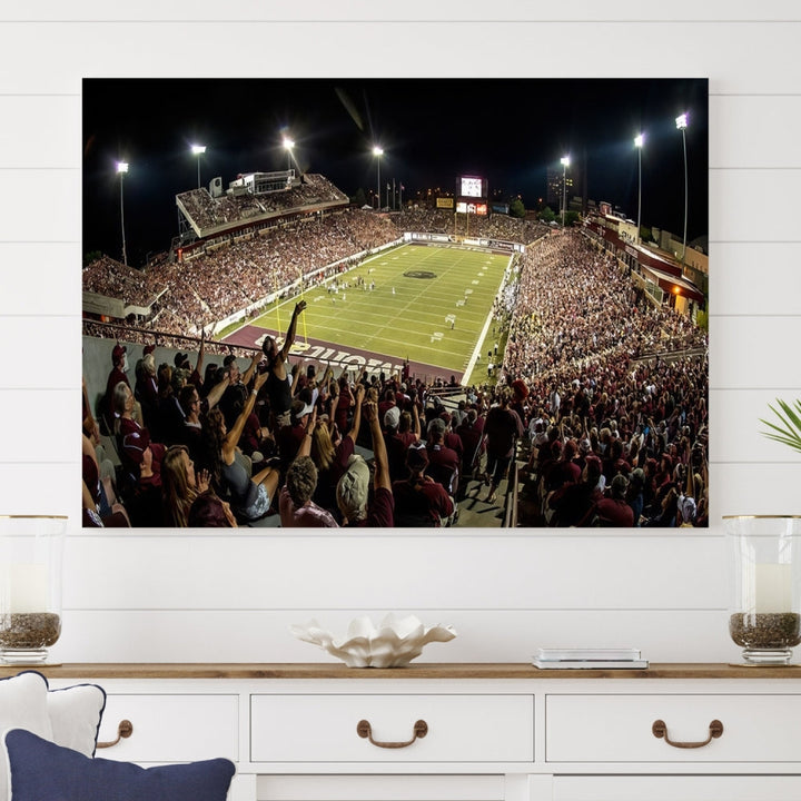 The Washington-Grizzly Stadium Canvas Print features a vibrant depiction of a packed football stadium at night. This American Football Wall Art is crafted on gallery-wrapped canvases with a UV-protective coating to maintain its lasting vibrancy.