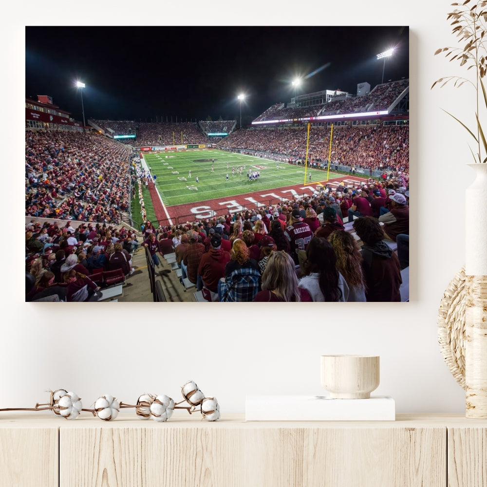 The Washington-Grizzly Stadium Canvas Wall Art beautifully depicts a lively night game scene under vibrant lights. The immersive game day atmosphere is captured in dynamic panoramic photography, making it ready to hang and enjoy.