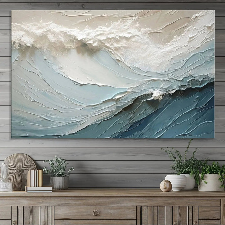 The Waves Abstract Wall Art Print, a captivating piece of modern framed abstract canvas, beautifully decorates the wall. This abstract painting is designed to enhance your living room decor and offers the convenience of being ready to hang.