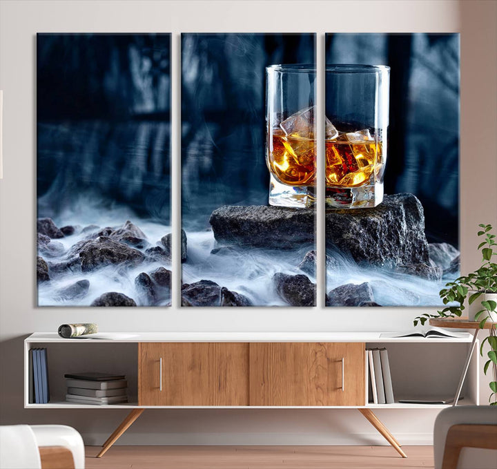 The Whiskey Ice Wall Art Canvas Print, a triptych featuring a glass of whiskey on the rocks, is crafted with a gallery-quality finish on premium canvas.