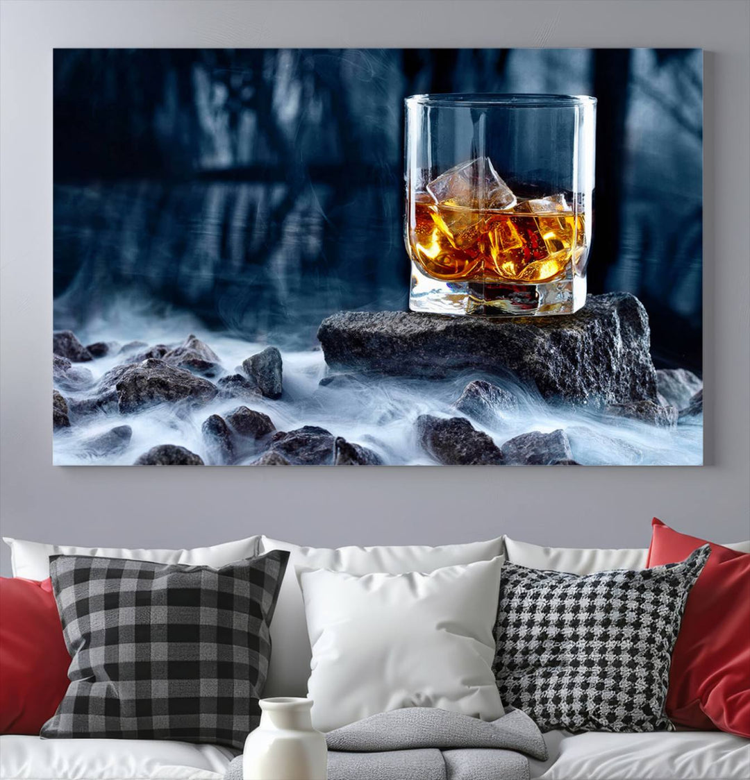 The Whiskey Ice Wall Art Canvas Print, a triptych featuring a glass of whiskey on the rocks, is crafted with a gallery-quality finish on premium canvas.