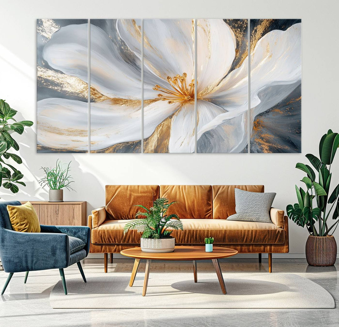 A triptych of "White and Gold Floral Canvas Wall Art - Framed and Ready to Hang" adorns the wall, creating an elegant modern living room display.