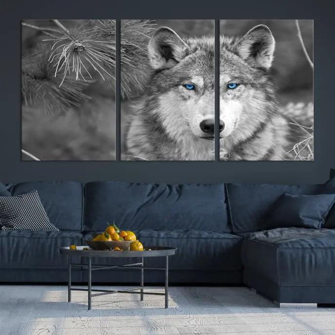 Displayed on the wall is the Wild Wolf Blue Eye Wall Art Canvas Print, a museum-quality triptych featuring a wolf with piercing blue eyes.