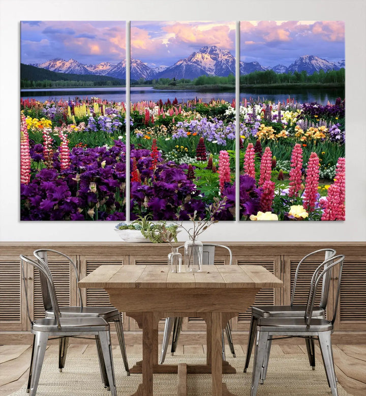 The wildflower canvas print, featuring blooming meadows and mountains, stylishly accents a modern living room.