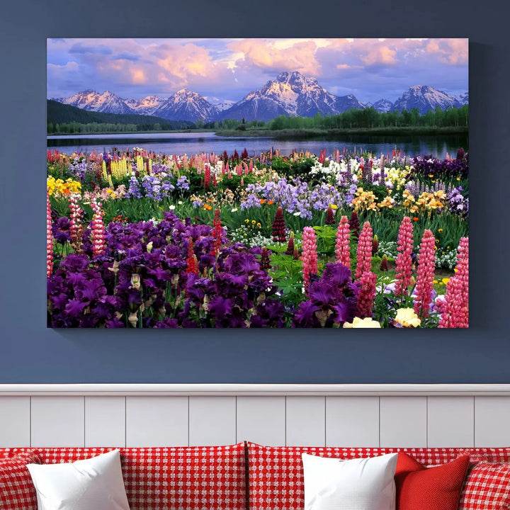 The wildflower canvas print, featuring blooming meadows and mountains, stylishly accents a modern living room.