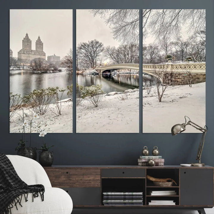 The dining room's winter scene is enhanced by the "Winter Park Wall Art" showcasing The Bow Bridge in Central Park, New York City as a premium canvas print, handcrafted in the USA.