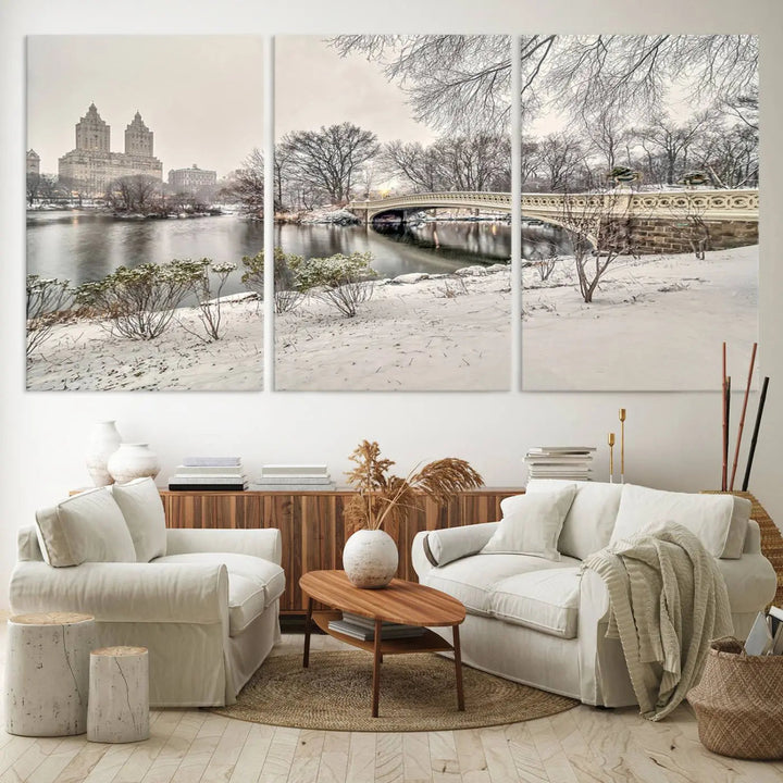 The dining room's winter scene is enhanced by the "Winter Park Wall Art" showcasing The Bow Bridge in Central Park, New York City as a premium canvas print, handcrafted in the USA.