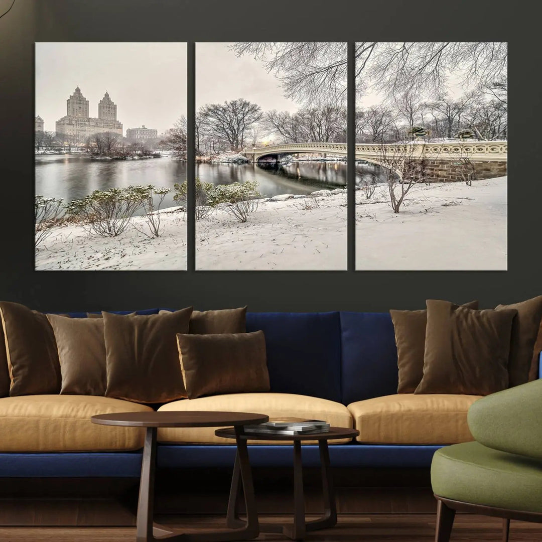 The dining room's winter scene is enhanced by the "Winter Park Wall Art" showcasing The Bow Bridge in Central Park, New York City as a premium canvas print, handcrafted in the USA.