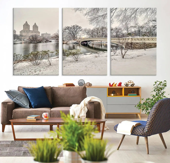 The dining room's winter scene is enhanced by the "Winter Park Wall Art" showcasing The Bow Bridge in Central Park, New York City as a premium canvas print, handcrafted in the USA.