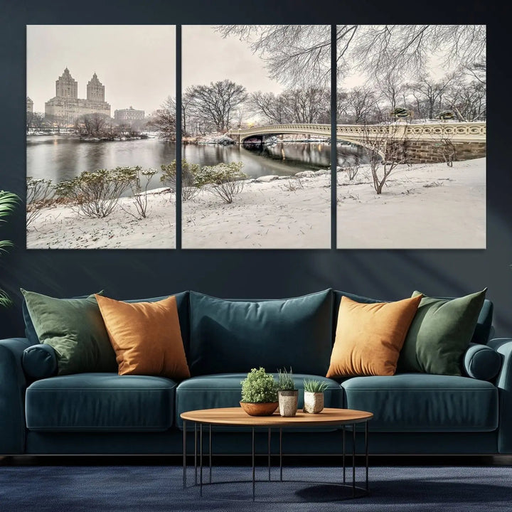 The dining room's winter scene is enhanced by the "Winter Park Wall Art" showcasing The Bow Bridge in Central Park, New York City as a premium canvas print, handcrafted in the USA.