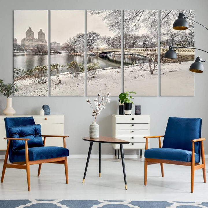 The dining room's winter scene is enhanced by the "Winter Park Wall Art" showcasing The Bow Bridge in Central Park, New York City as a premium canvas print, handcrafted in the USA.