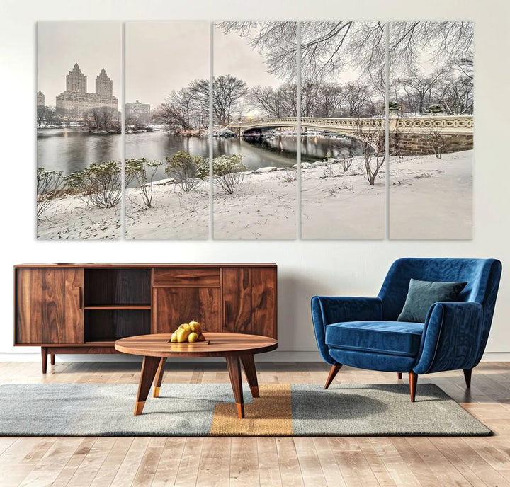 The dining room's winter scene is enhanced by the "Winter Park Wall Art" showcasing The Bow Bridge in Central Park, New York City as a premium canvas print, handcrafted in the USA.