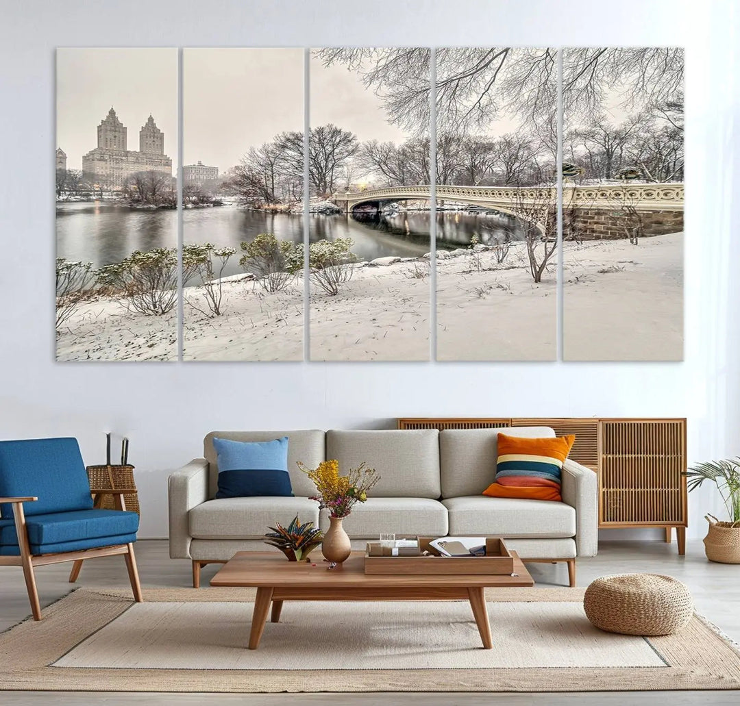 The dining room's winter scene is enhanced by the "Winter Park Wall Art" showcasing The Bow Bridge in Central Park, New York City as a premium canvas print, handcrafted in the USA.