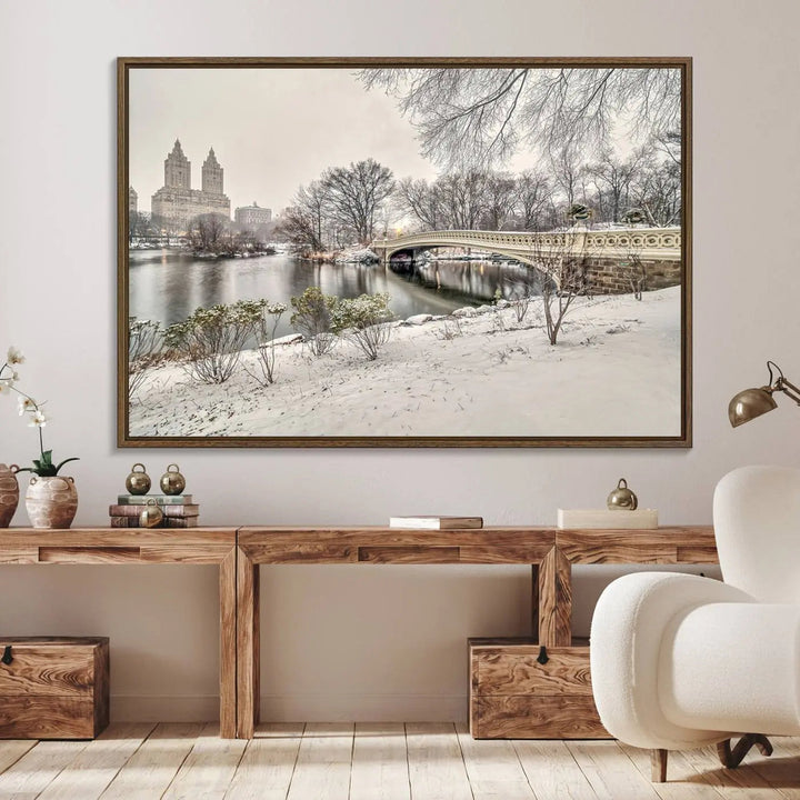 The dining room's winter scene is enhanced by the "Winter Park Wall Art" showcasing The Bow Bridge in Central Park, New York City as a premium canvas print, handcrafted in the USA.