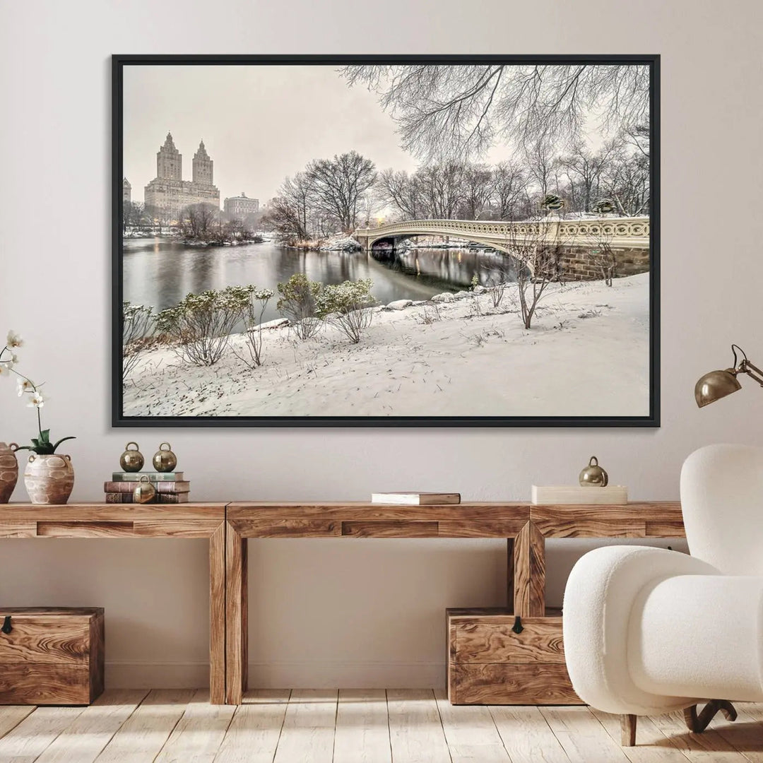 The dining room's winter scene is enhanced by the "Winter Park Wall Art" showcasing The Bow Bridge in Central Park, New York City as a premium canvas print, handcrafted in the USA.