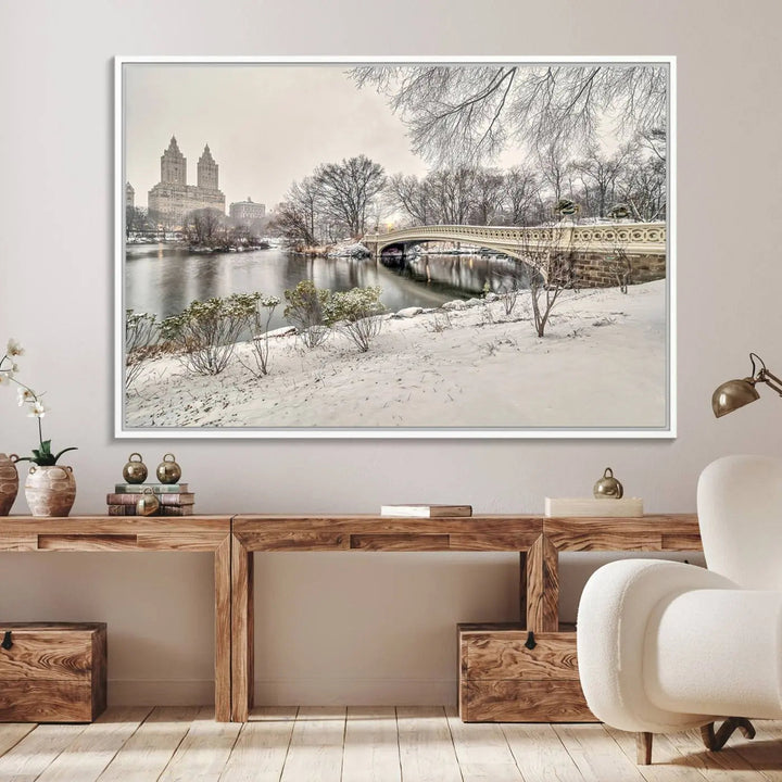 The dining room's winter scene is enhanced by the "Winter Park Wall Art" showcasing The Bow Bridge in Central Park, New York City as a premium canvas print, handcrafted in the USA.